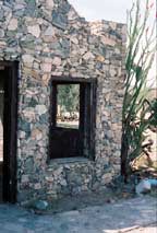 stone house with ocotillo
